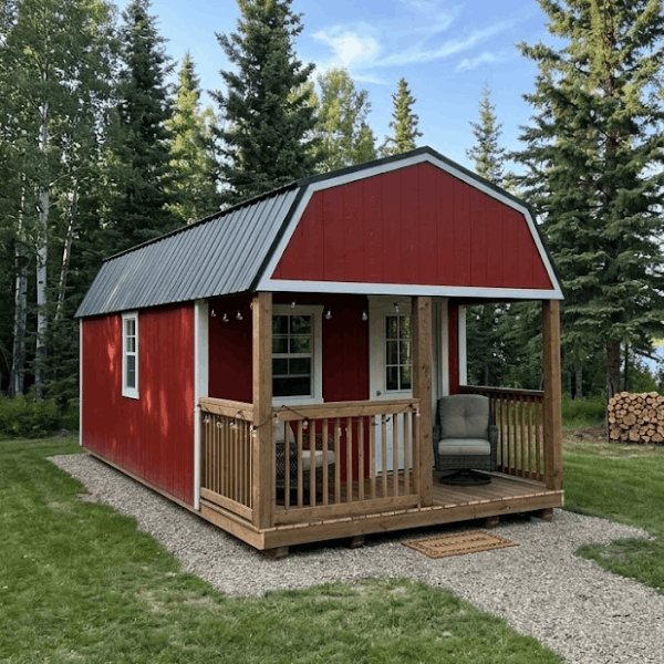 Red Premier lofted portable cabin with covered porch in Alberta