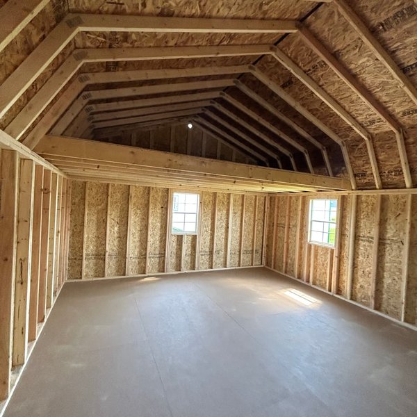 Interior of a Premier lofted cabin with storage loft and windows